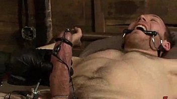 Bound gay punished by muscle master