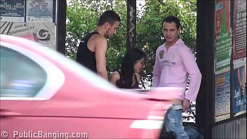 A big natural breasted brunette in public street bus stop threesome orgy gang bang with 2 hung guys with big dicks fucking her with a blowjob and vaginal pussy sex action in front of all the car, bus, and truck drivers and people walking on the stree