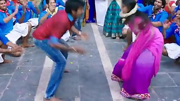 Indian people dancing on a street - movie scene
