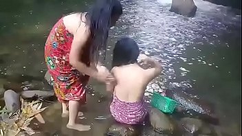 Beautiful girls having bath outdoor