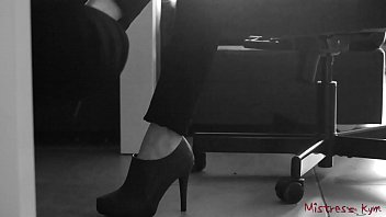 Submissive licks his Domme high heels and feet