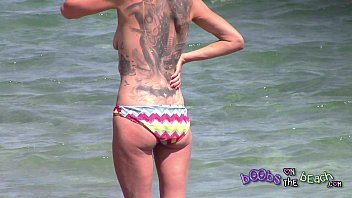 Large Tattoo on back of Skinny German MILF getting angry with her phone sex